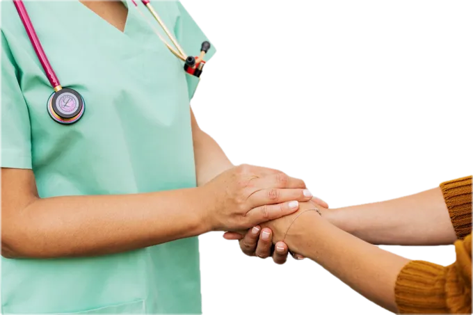 A clinician holding a woman's hands in support